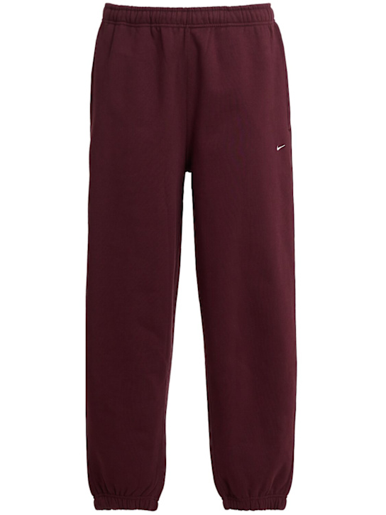 Nike - Pantaloni Solo Swoosh in felpa