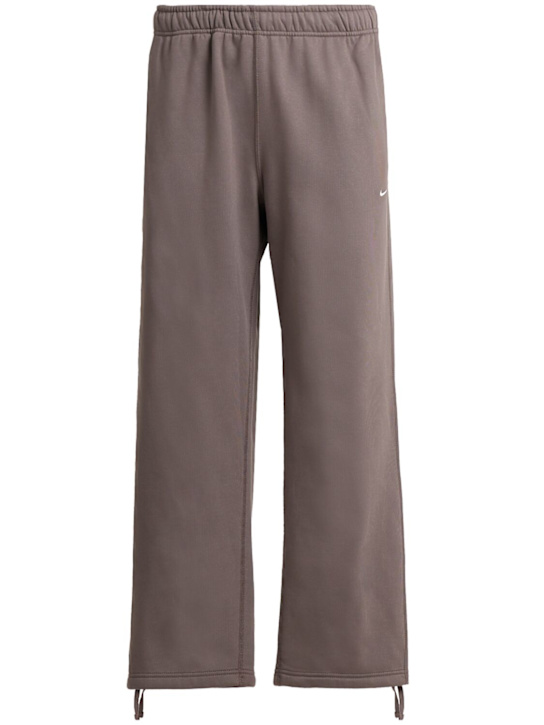 Nike - Pantaloni Solo Swoosh in felpa
