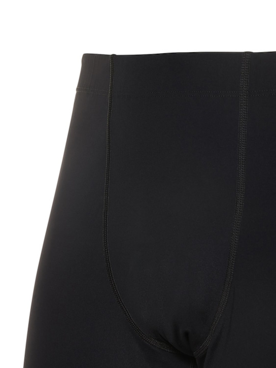 Jil Sander: LEGGINGS AUS TECHNOSTOFF MIT LOGODRUCK