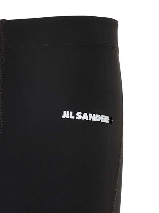 Jil Sander: LEGGINGS AUS TECHNOSTOFF MIT LOGODRUCK