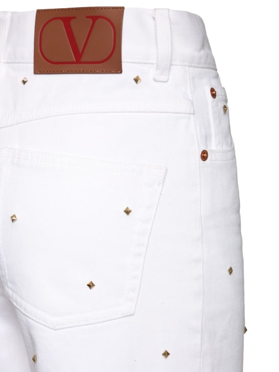 Valentino: Rockstud high rise denim wide jeans