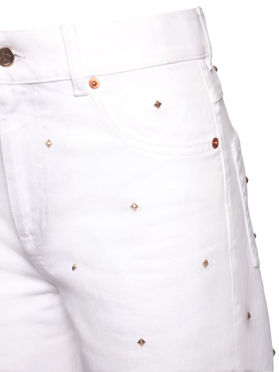 Valentino: Rockstud high rise denim wide jeans
