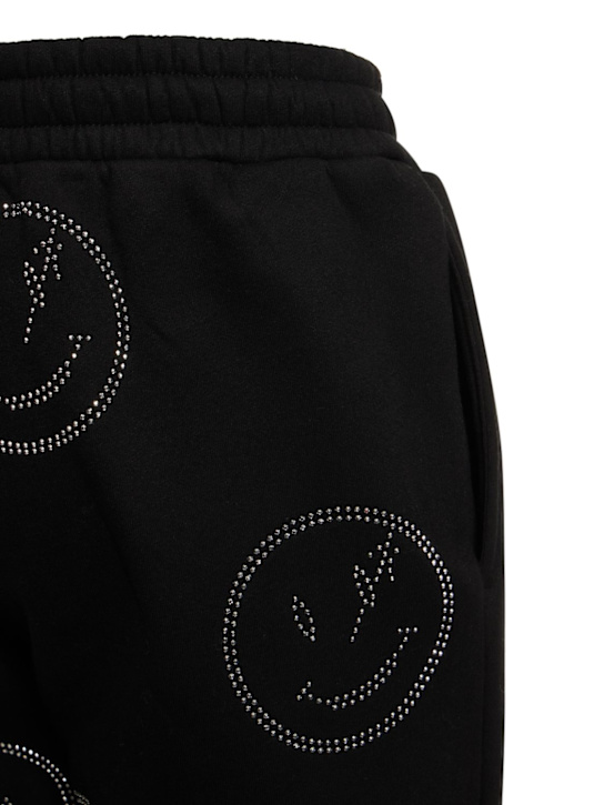 Retrovert: Trainingshose mit Strass-Smileys