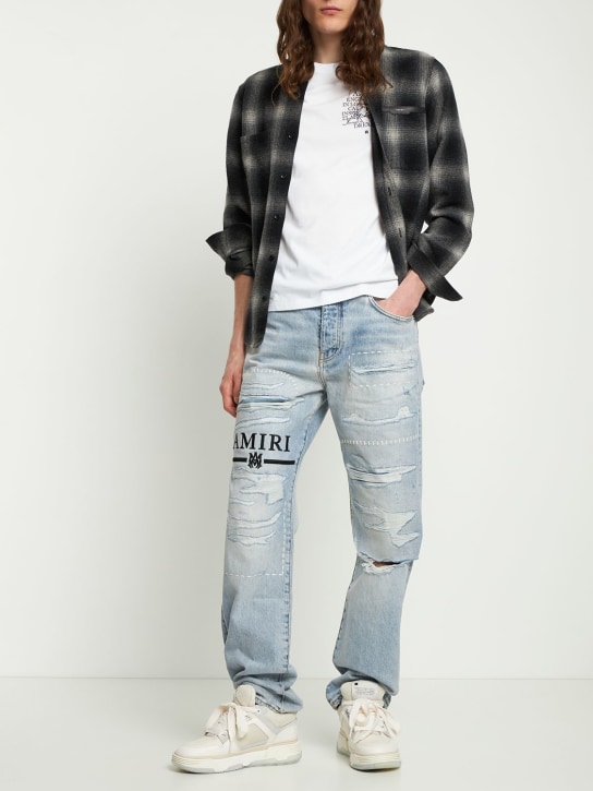 Amiri: Flare jeans with ripped details