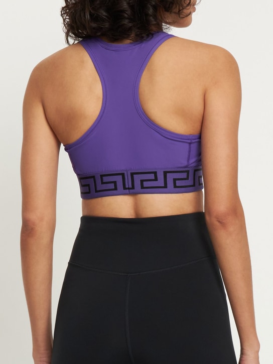 Versace: Brassière de sport tissu technique stretch Greca