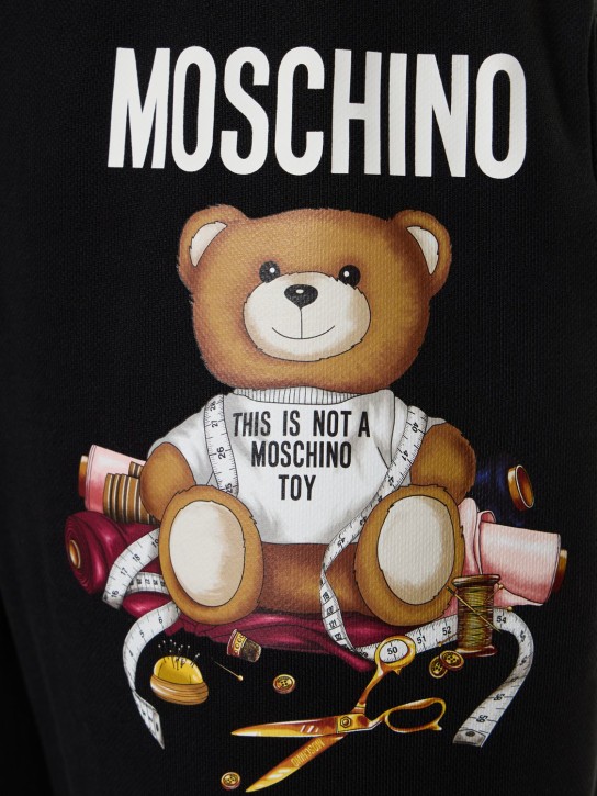 Moschino: Logo printed cotton sweatpants