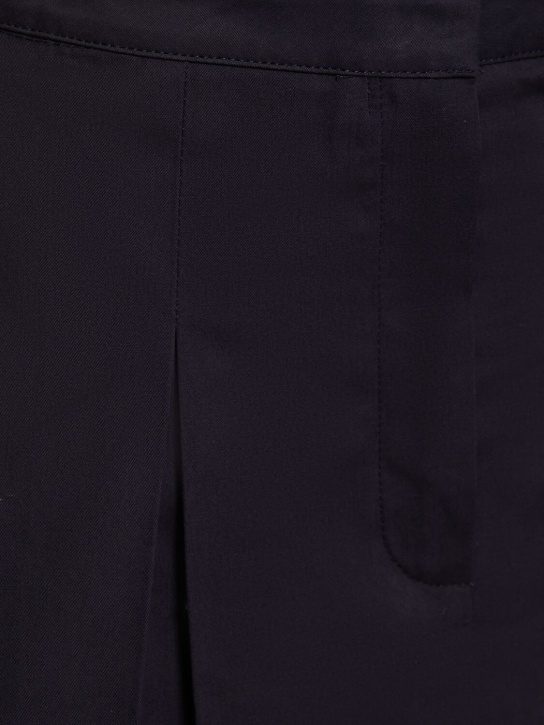 Sporty & Rich: Jupe à double plis Serif