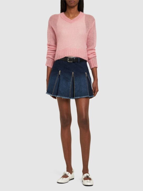 Cannari Concept: Jupe courte en denim à plis avec zips