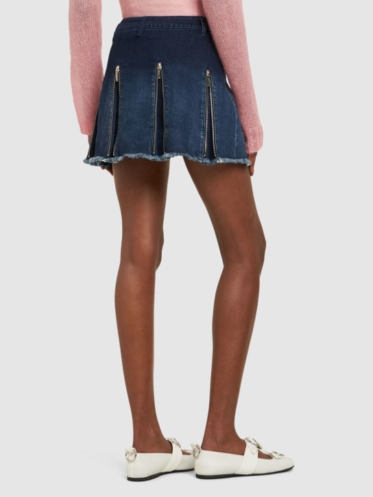 Cannari Concept: Jupe courte en denim à plis avec zips