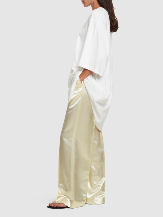 The Row: Pantalon évasé en satin taille mi-haute Encore