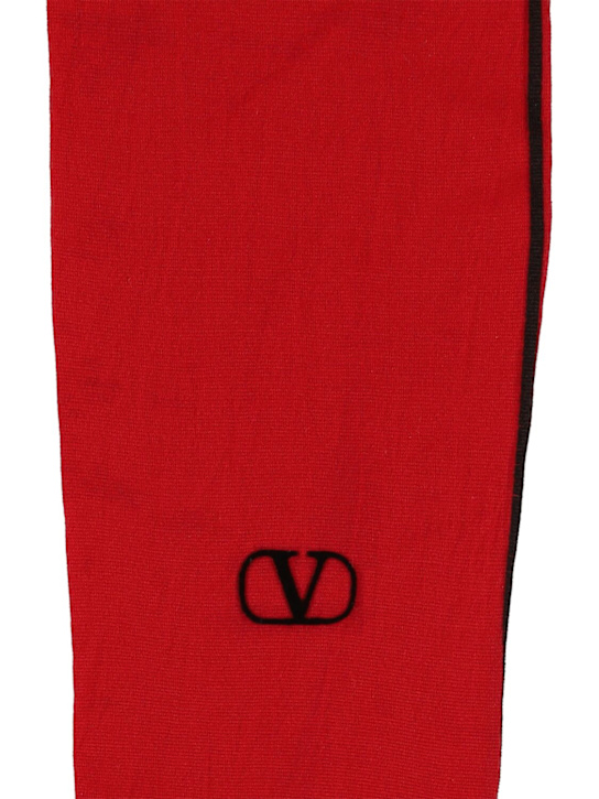Valentino: Collant a righe in pizzo con logo