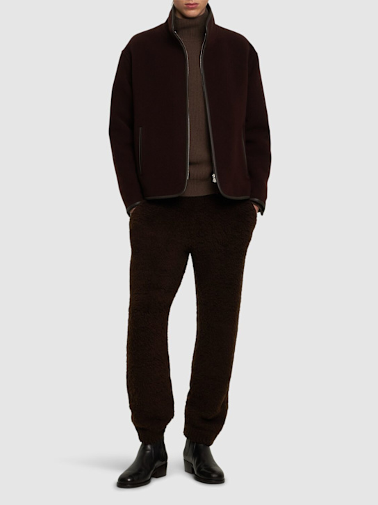 Auralee: Wool blend boa knit pants