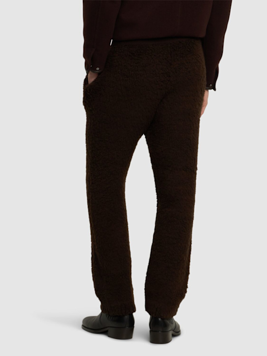 Auralee: Wool blend boa knit pants