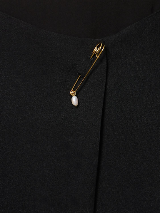 Carven: Jupe mi-longue en viscose avec broche