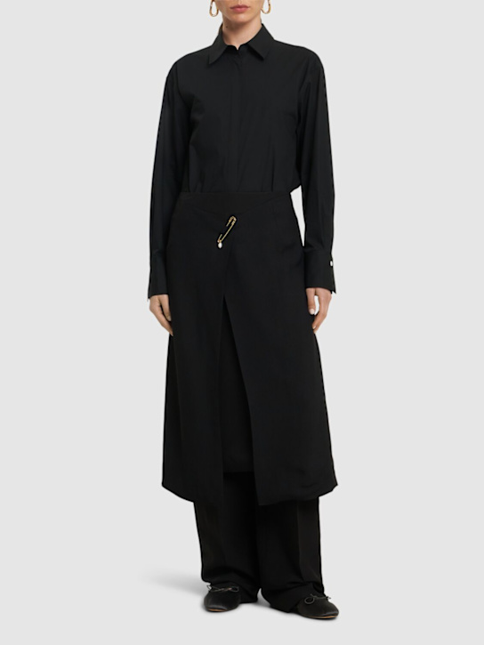 Carven: Jupe mi-longue en viscose avec broche