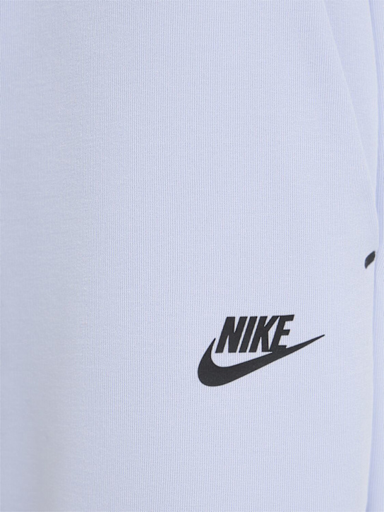 Nike: Pantaloni in techno pile