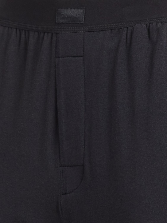 SKIMS: Pantalon boyfriend loose en mélange de coton