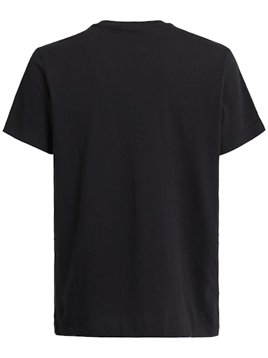 SKIMS: Camiseta de algodón