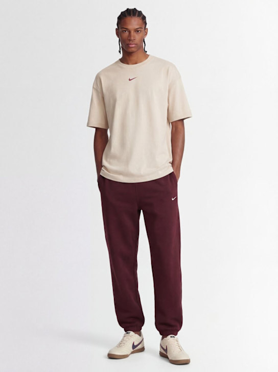 Nike - Pantaloni Solo Swoosh in felpa