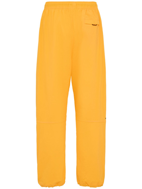 Nike: Pantaloni in techno