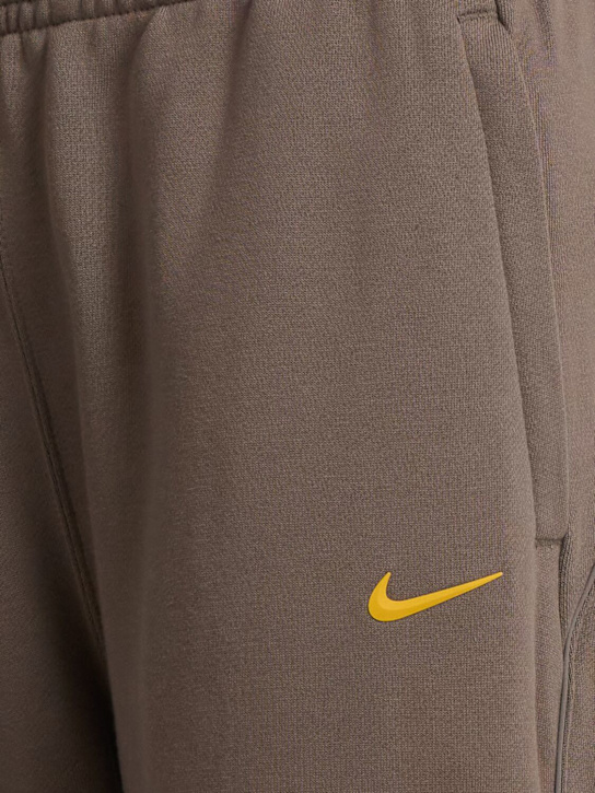 Nike: Pantaloni dritti Nocta in pile