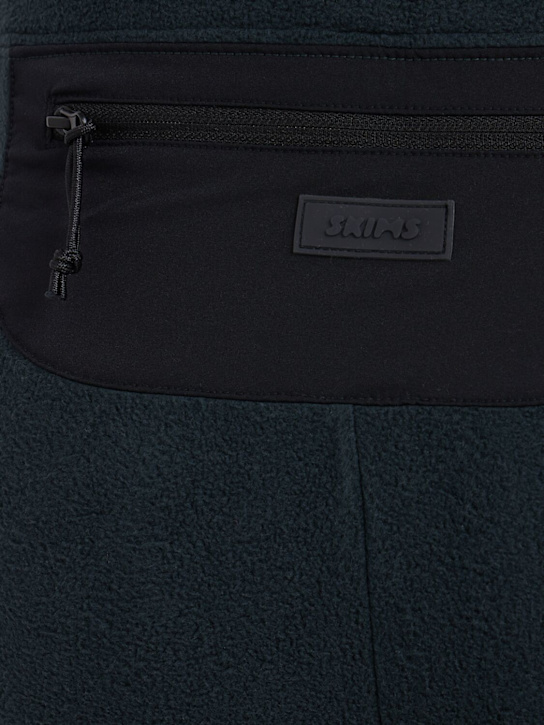 SKIMS: Flared poly pants