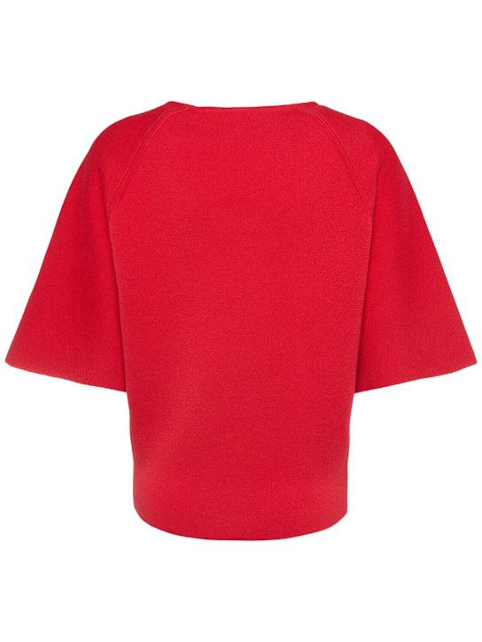 Khaite: Maglia Warren a maniche corte in lana