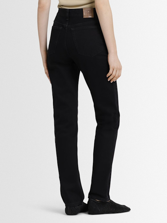Toteme: Jean slim en denim de coton taille haute