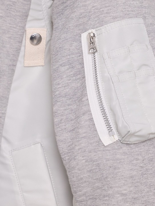 Sacai: Hoodie aus Fleece und Nylontwill