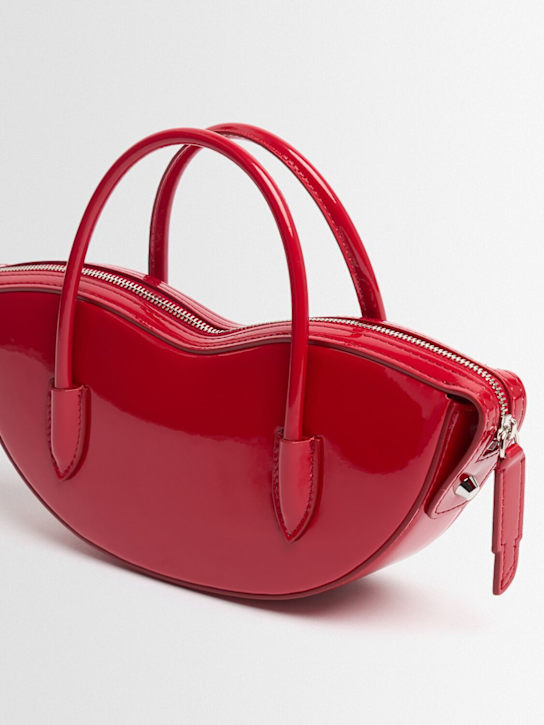 FIORUCCI: Mini Lips vinyl top handle bag