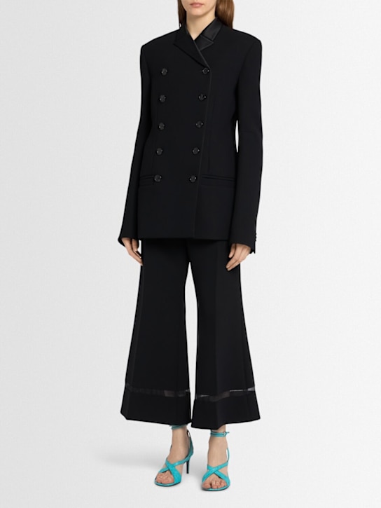 Khaite: Wallace flared poly pants