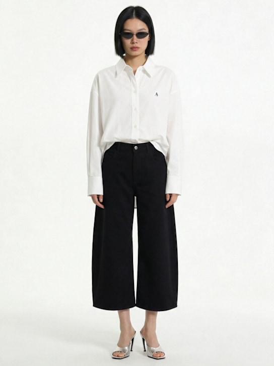 The Attico - Curved cropped jeans