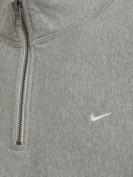 Nike: Solo Swoosh quarter zip sweatshirt