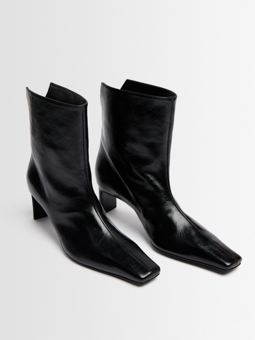 Khaite: Ona glazed calf leather ankle boots