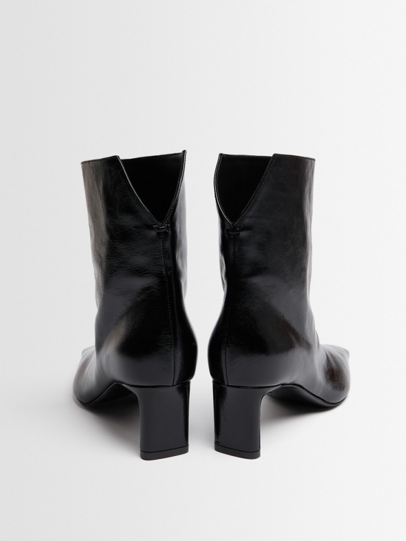 Khaite: Ona glazed calf leather ankle boots
