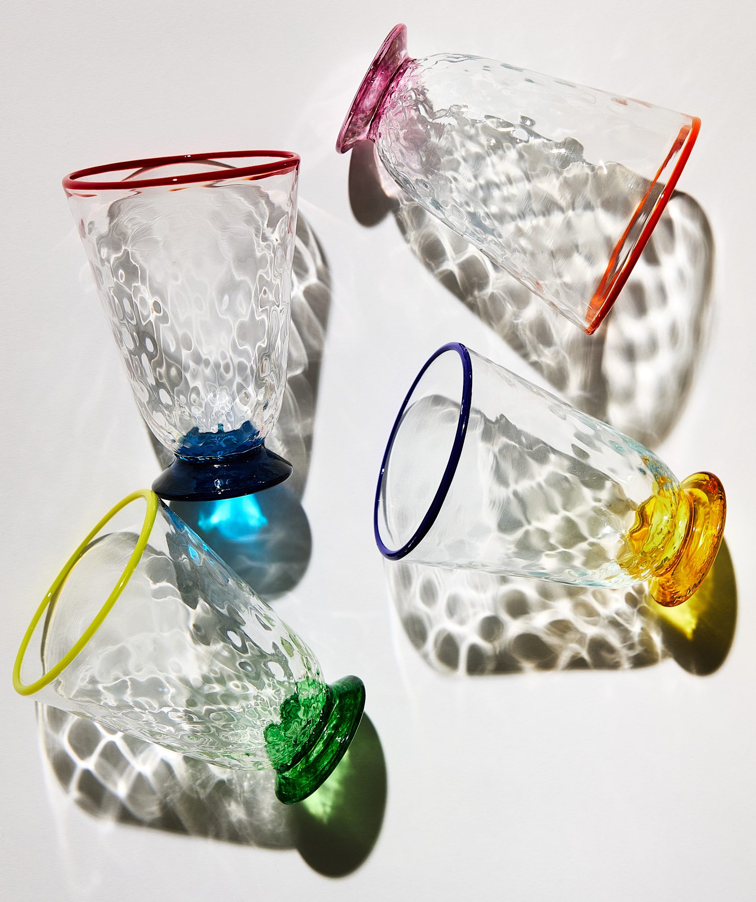 four Murano glass quilted effect classes with colored rims and bases