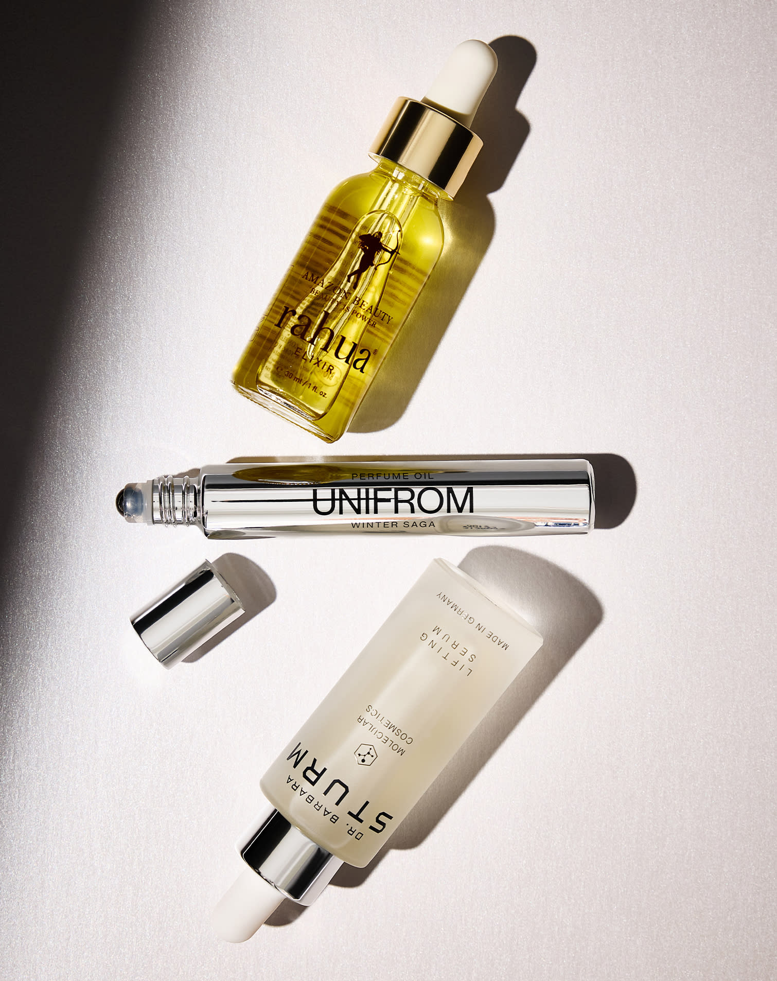 Elixir Rahua, profumo roll-on Unifrom Winter Saga, Siero Dr. Barbara Sturm Lifting Serum